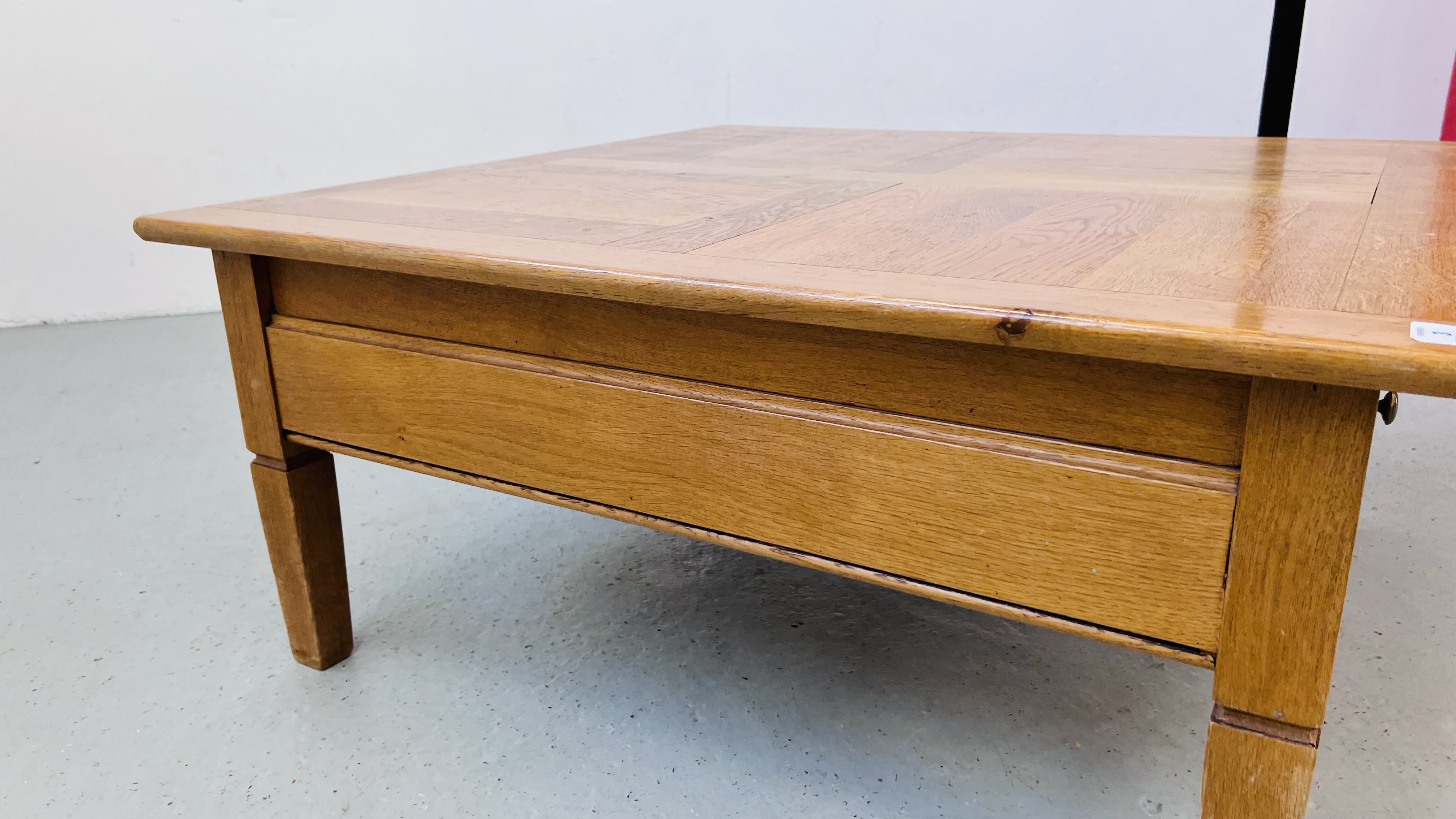 A SOLID OAK TWO DRAWER COFFEE TABLE W 100CM, D 100CM, H 46CM. - Image 7 of 11