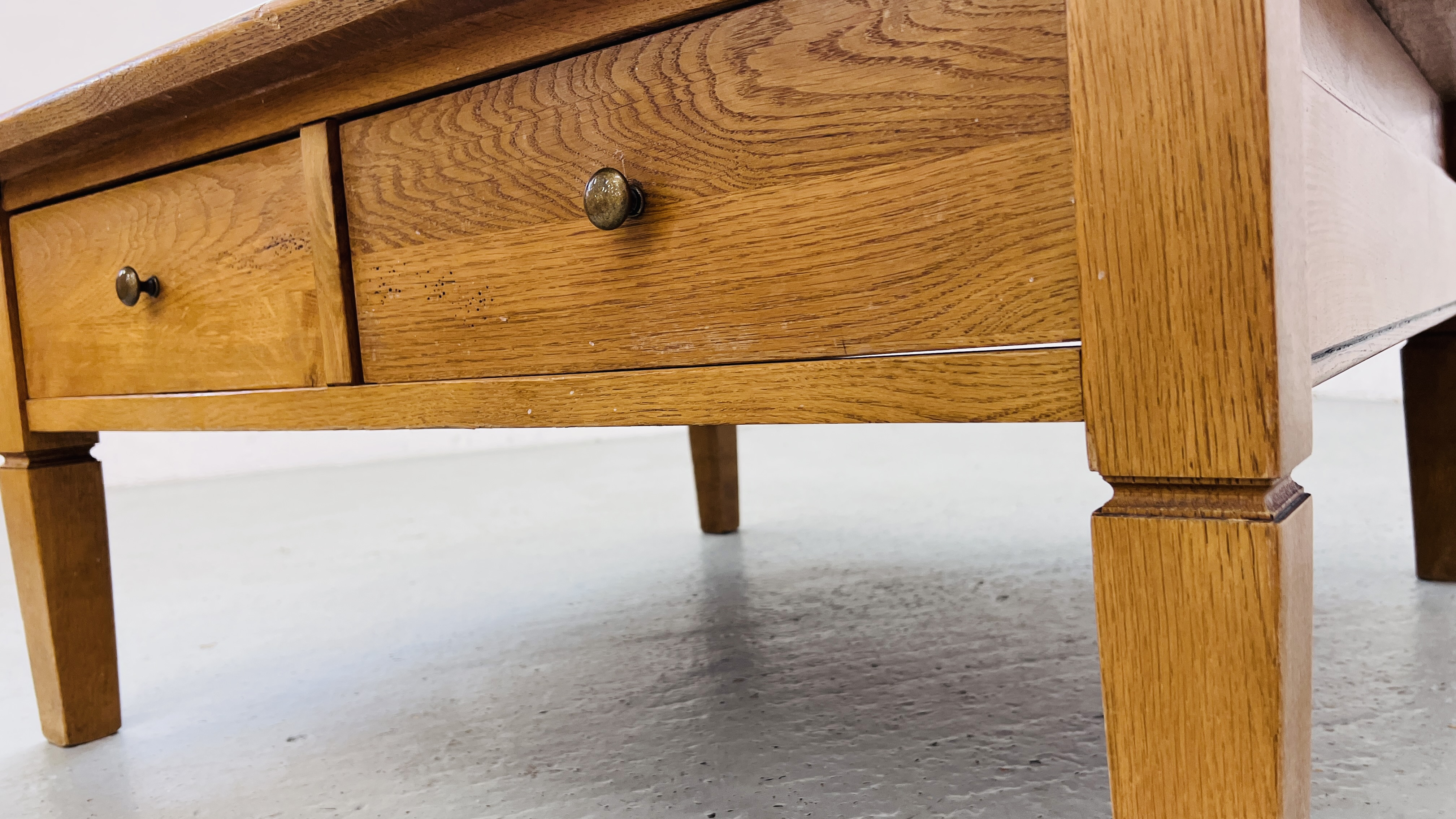 A SOLID OAK TWO DRAWER COFFEE TABLE W 100CM, D 100CM, H 46CM. - Image 11 of 11