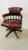 AN OX BLOOD AND BUTTON BACK CAPTAINS STYLE OFFICE CHAIR
