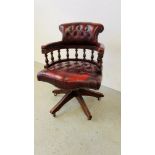 AN OX BLOOD AND BUTTON BACK CAPTAINS STYLE OFFICE CHAIR