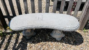 A STONEWORK GARDEN BENCH ON CLASSICAL OTTER SUPPORTS L 112CM X H 42CM.