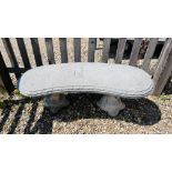 A STONEWORK GARDEN BENCH ON CLASSICAL OTTER SUPPORTS L 112CM X H 42CM.