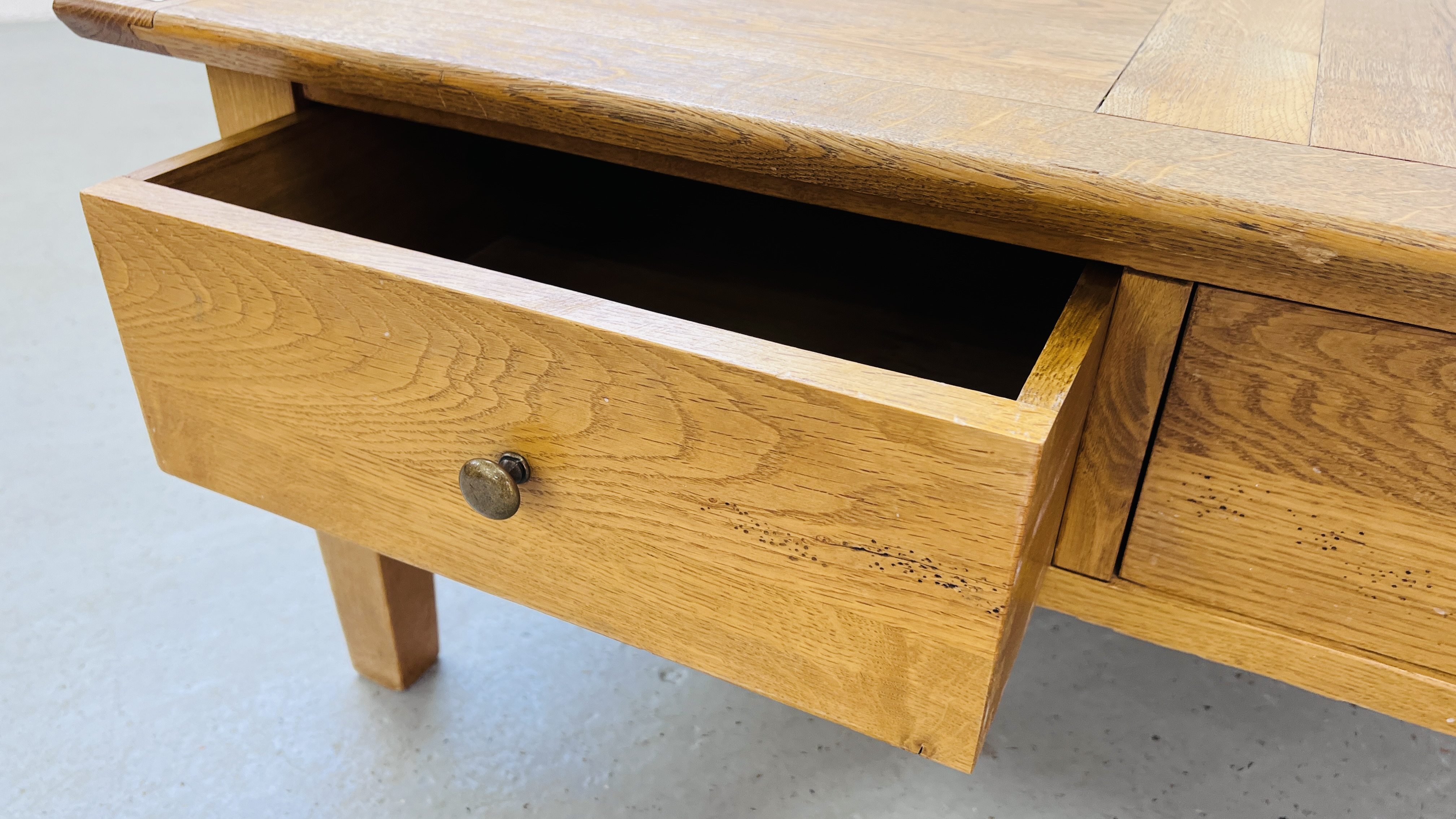 A SOLID OAK TWO DRAWER COFFEE TABLE W 100CM, D 100CM, H 46CM. - Image 9 of 11