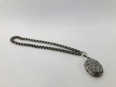 A SILVER PENDANT LOCKET ON WHITE METAL NECKLACE.