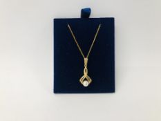 9CT. GOLD PENDANT SET WITH A SINGLE PEARL ON A FINE 9CT.