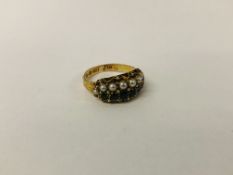 ANTIQUE SEED PEARL AND EMERALD RING IN A DECORATIVE ENGRAVED SETTING MARKED 15CT.