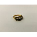 ANTIQUE SEED PEARL AND EMERALD RING IN A DECORATIVE ENGRAVED SETTING MARKED 15CT.
