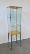 A DESIGNER DISPLAY CABINET ON CHROME STAND WIDTH 47CM. DEPTH 37CM. HEIGHT 172CM.