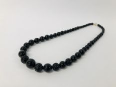 BLACK STONE CARVED NECKLACE WITH CLASP MARKED 585 (14K).