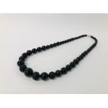 BLACK STONE CARVED NECKLACE WITH CLASP MARKED 585 (14K).