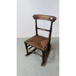 VICTORIAN OAK ROCKING CHAIR WITH REEDED SEAT.