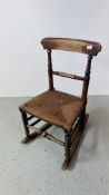 VICTORIAN OAK ROCKING CHAIR WITH REEDED SEAT.