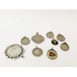 NINE ASSORTED SILVER MOUNTED COIN PENDANTS