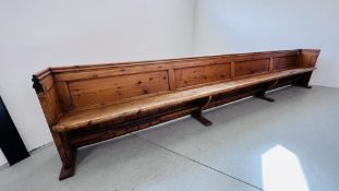 AN ANTIQUE PINE CHAPEL PEW LENGTH 4.