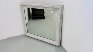 A RUSTIC STYLE RECTANGULAR WALL MIRROR IN PAINTED FRAME.