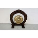 HANDMADE INDONESIAN BRASS GONG MANUFACTURED IN THE BOGOR FACTORY ON A HARDWOOD STAND, D 17 INCH.