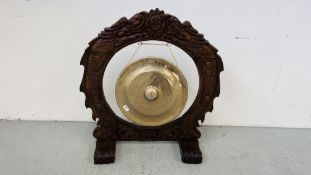 HANDMADE INDONESIAN BRASS GONG MANUFACTURED IN THE BOGOR FACTORY ON A HARDWOOD STAND, D 17 INCH.