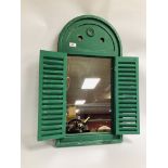A GREEN FRENCH STYLE LOUVERED DOOR WALL MIRROR.