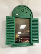 A GREEN FRENCH STYLE LOUVERED DOOR WALL MIRROR.