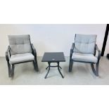 A MODERN METAL FRAMED PATIO SET COMPRISING PAIR OF ROCKING CHAIRS WITH CUSHIONED SEATS AND GLASS