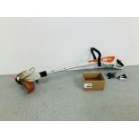 A STIHL FSA 45 RECHARGEABLE ELECTRIC STRIMMER WITH QUANTITY OF BLADES AND CHARGER - SOLD AS SEEN