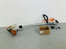 A STIHL FSA 45 RECHARGEABLE ELECTRIC STRIMMER WITH QUANTITY OF BLADES AND CHARGER - SOLD AS SEEN