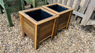 A PAIR OF SQUARE STAINED FINISH RAISED PLANTERS WITH PLASTIC LINER, W 40CM, D 40CM, H 44CM.