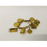 A YELLOW METAL BRACELET (CONTINENTAL MARKS) WITH NINE VARIOUS CHARMS/COINS ATTACHED TO INCLUDE :-