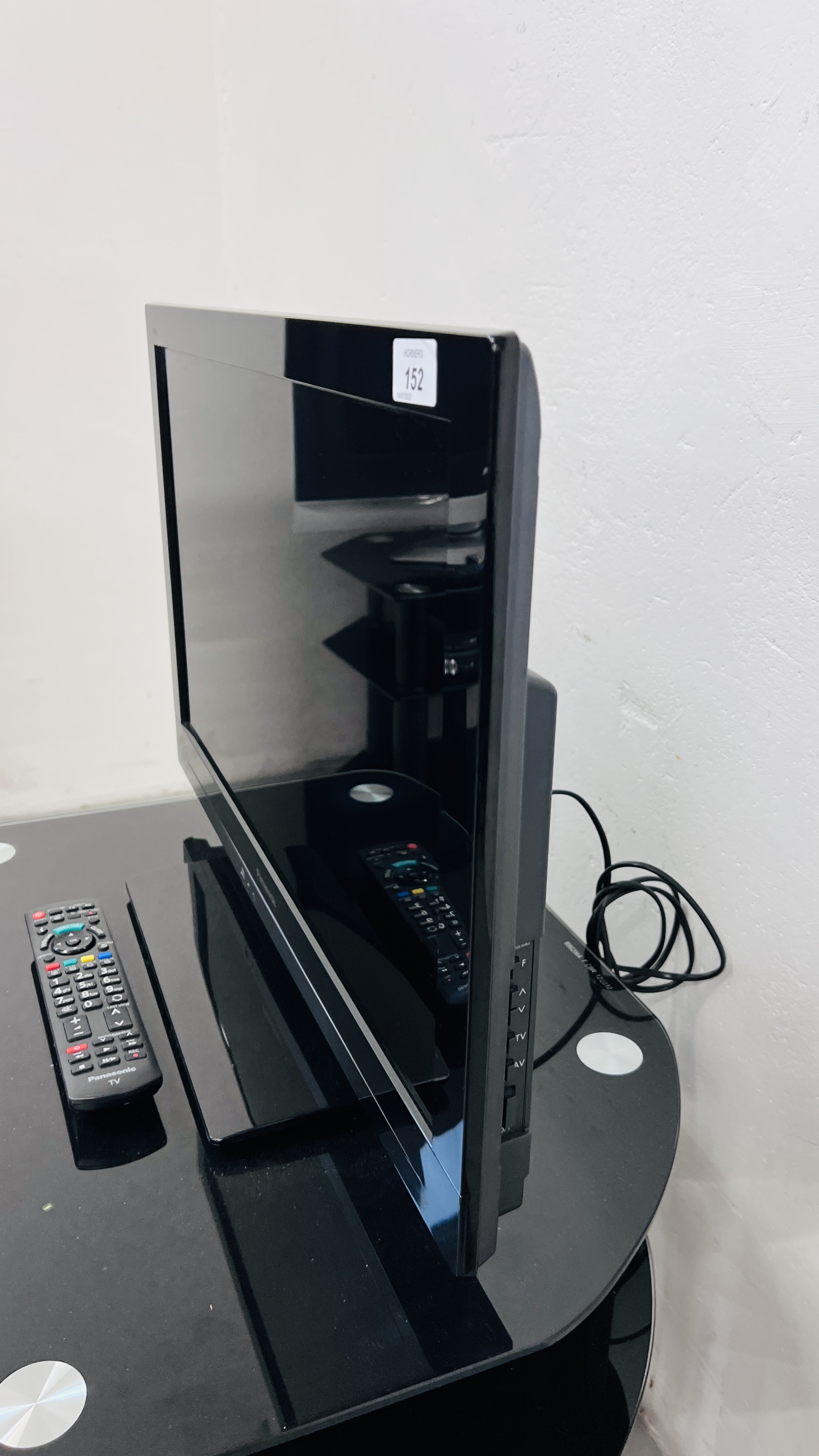 A PANASONIC VIERA 24 INCH TELEVISION COMPLETE WITH REMOTE AND MODERN BLACK GLASS STAND - SOLD AS - Image 4 of 5