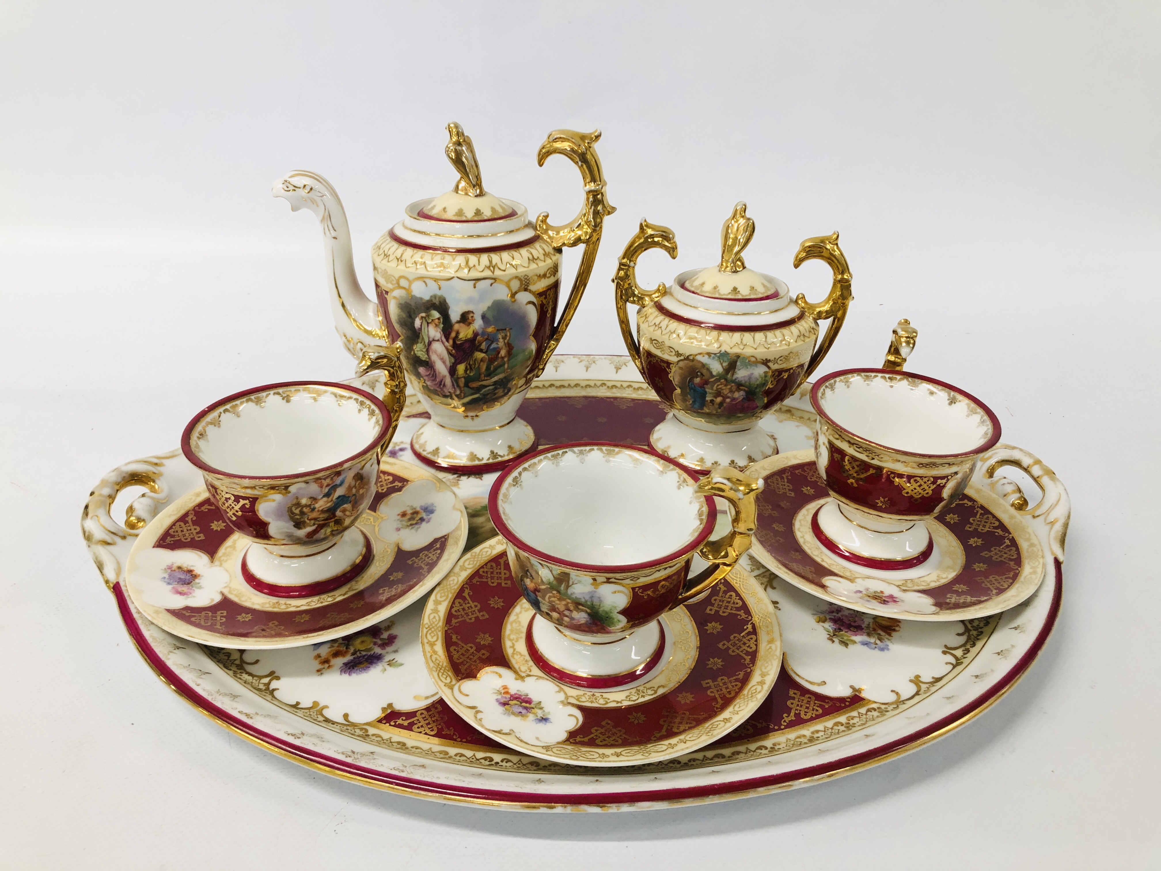 A VIENNA CABARET TEA SERVICE COMPRISING TEAPOT AND COVER, TWO HANDLED SUCRIER AND COVER,