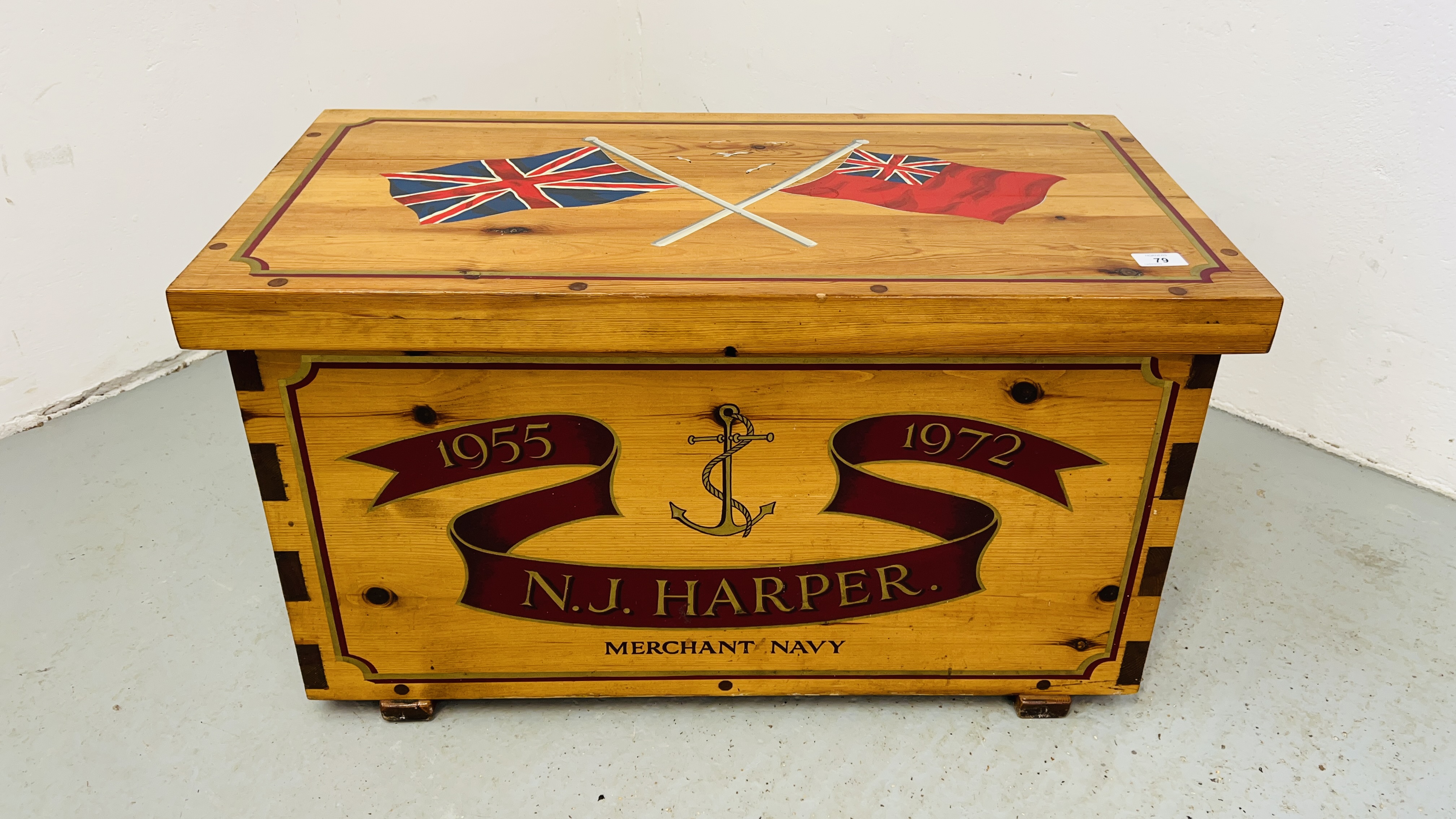 A WAXED PINE REPRODUCTION SEAMANS KIT BOX COMPLETE WITH BECKETT HANDLES AND UNION JACK FLAGS
