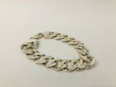 A HEAVY SILVER FLAT LINK BRACELET.