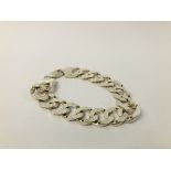 A HEAVY SILVER FLAT LINK BRACELET.