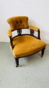 A VINTAGE MAHOGANY FRAMED TUB CHAIR ON CERAMIC CASTERS,