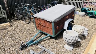 A SINGLE AXLE CAR TRAILER COMPLETE WITH SPARE WHEEL