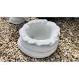 A STONEWORK "SACK" DESIGN GARDEN PLANTER.