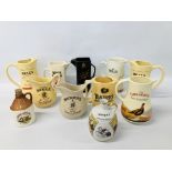 COLLECTION OF 9 PUB ADVERTISING JUGS AND TWO DECANTERS.