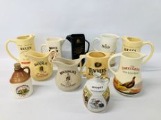 COLLECTION OF 9 PUB ADVERTISING JUGS AND TWO DECANTERS.