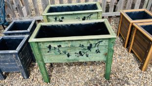 A PAIR OF RUSTIC RECTANGULAR RAISED PLANTERS WITH STENCILED BIRD DETAILING AND PLASTIC LINER,
