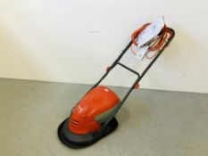 A FLYMO HOVER VAC 250 25CM COLLECT LAWN MOWER 1400W + ADDITIONAL BOXED BLADE - SOLD AS SEEN.