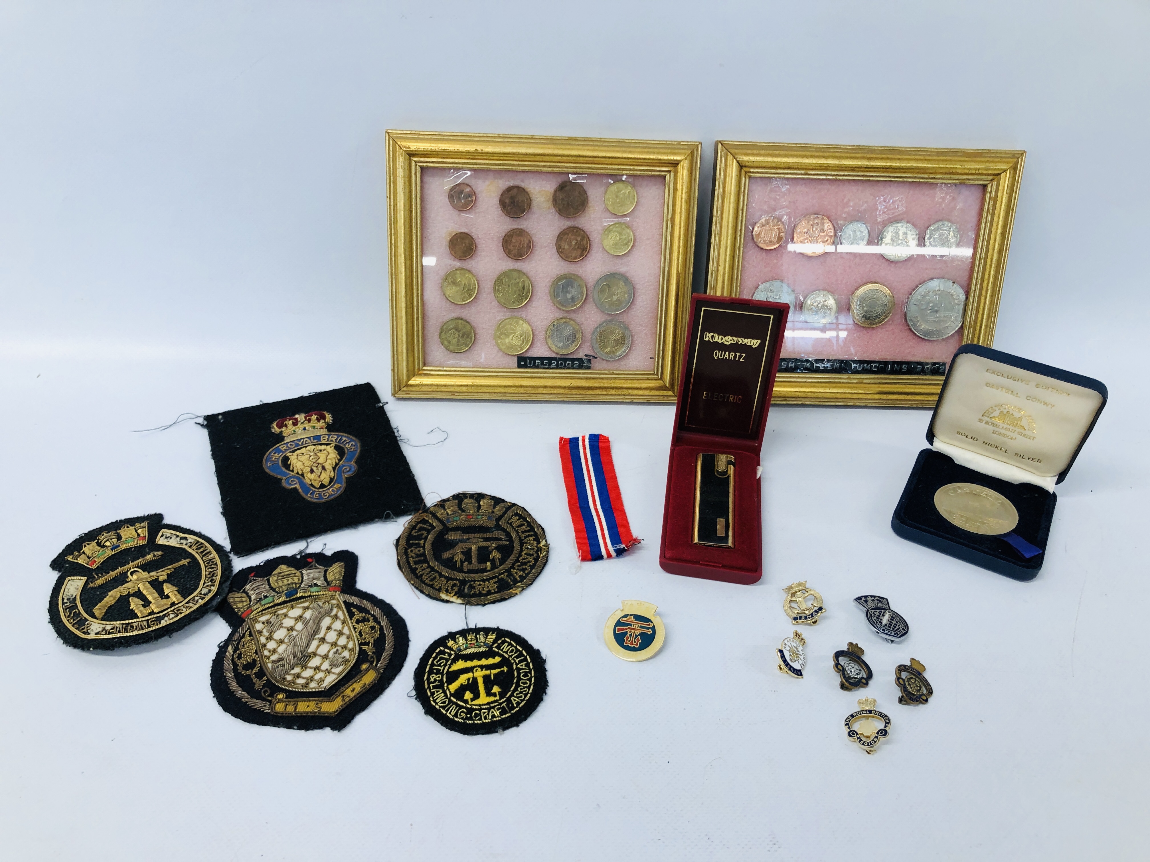 A COLLECTION OF FRAMED COINS TO INCLUDE URS 2002 AND BRITISH MILLENNIUM COINS,