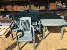 A RECTANGULAR GREEN UPVC PATIO TABLE AND FIVE PATIO CHAIRS.