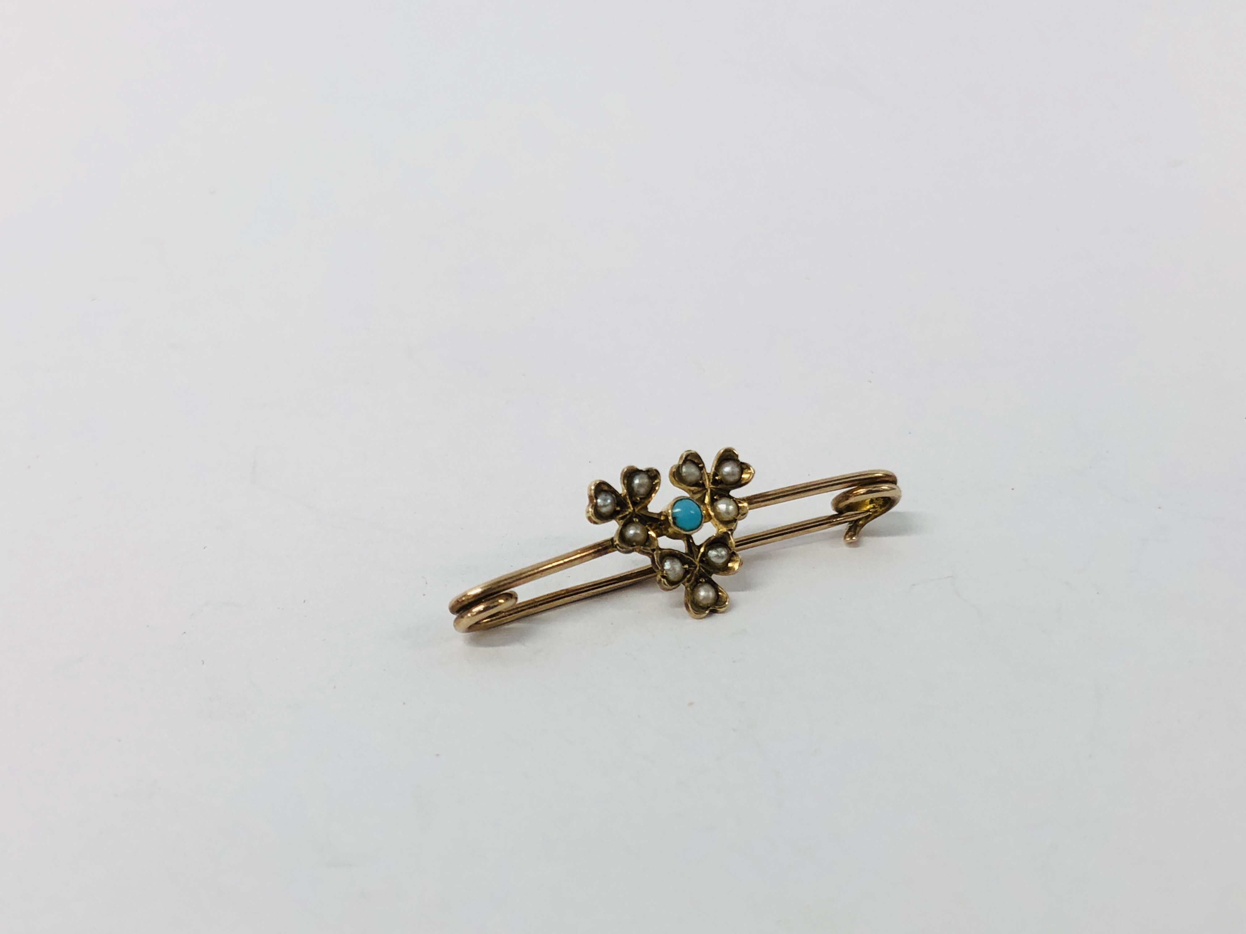 A "MURRLE BENNETT" 9CT GOLD TURQUOISE AND SEED PEARL BAR BROOCH.