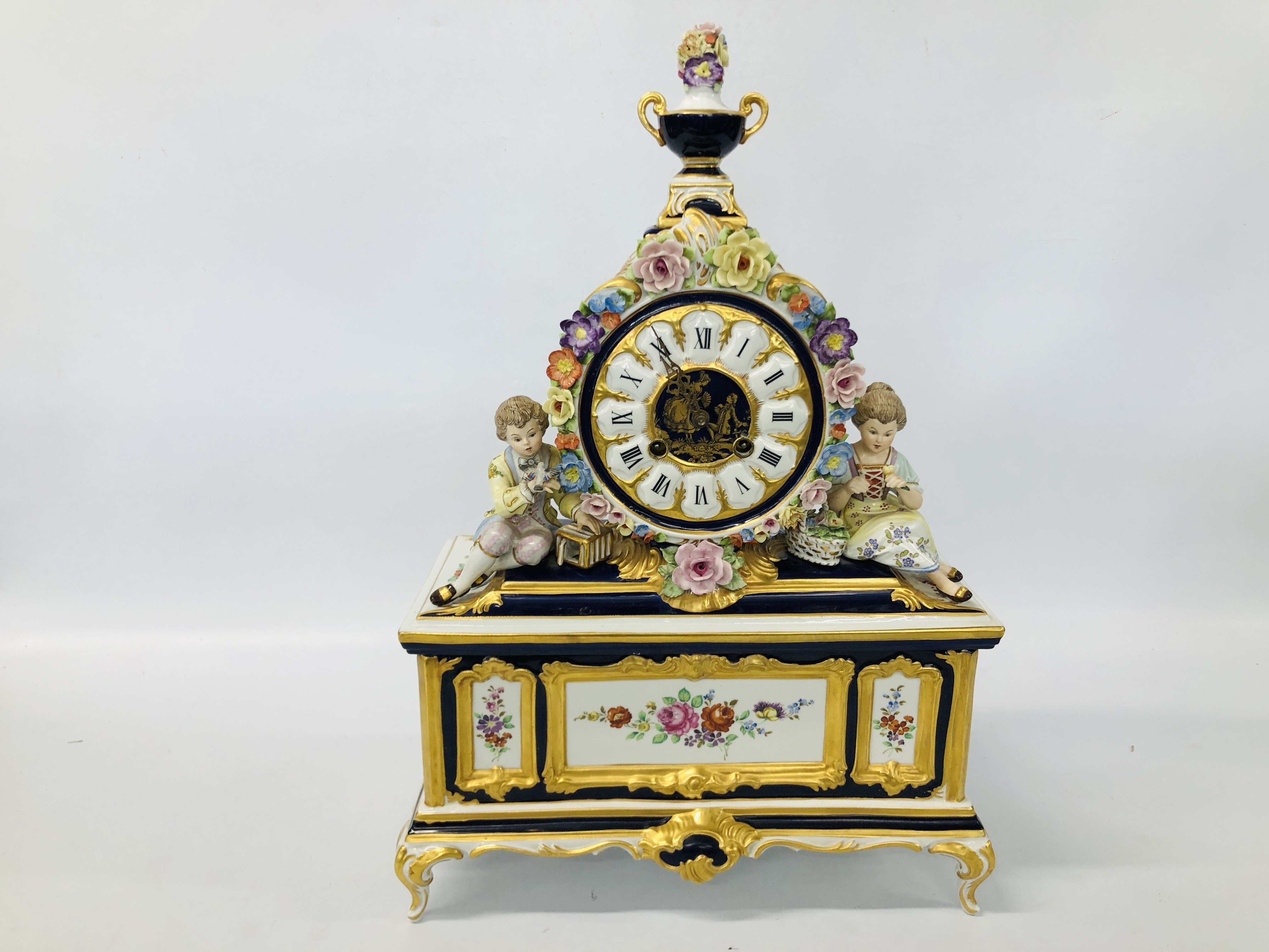 HIGHLY DECORATIVE MODERN PORCELAIN DRESDEN CLOCK ADORNED WITH BRIGHTLY COLOURED FLOWERS AND GILT