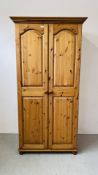 A HONEY PINE DOUBLE WARDROBE WIDTH 96CM. DEPTH 56CM. HEIGHT 188CM.