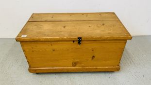 A WAXED PINE BLANKET BOX WITH METAL CRAFT HANDLES