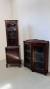AN OAK TWO DOOR DISPLAY CABINET WITH LEADED GLASS AND SHAPED FRONT ALONG WITH A NARROW GLAZED TOP
