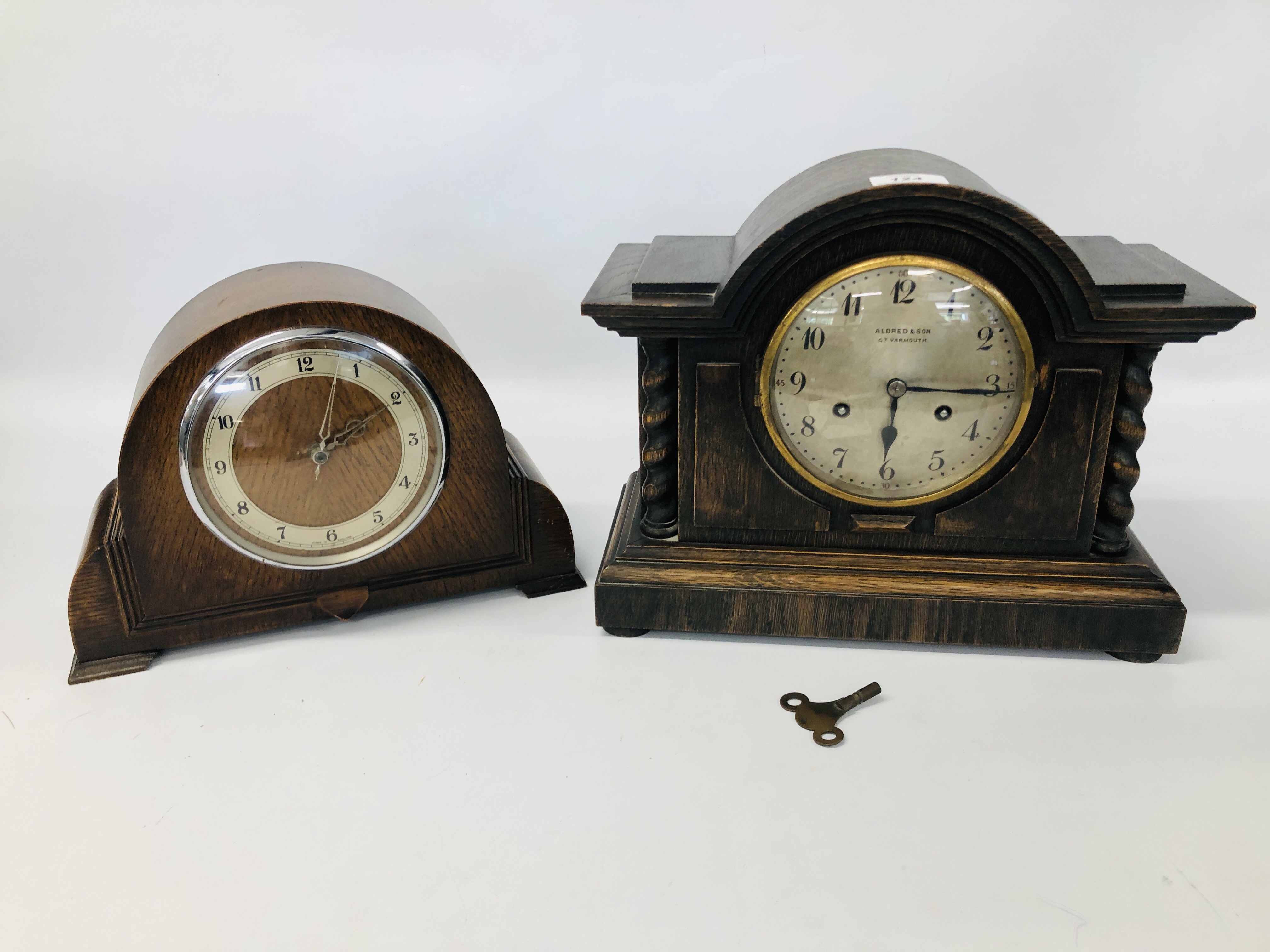 VINTAGE ALDRED & SON GREAT YARMOUTH OAK CASED MANTEL CLOCK ALONG WITH ONE OTHER.