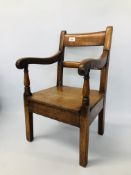 A CHILD'S OAK ELBOW CHAIR HEIGHT 57CM.