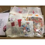 FOUR BOXES WITH VAST ACCUMULATION OF STAMPS IN ENVELOPES, BAGS,